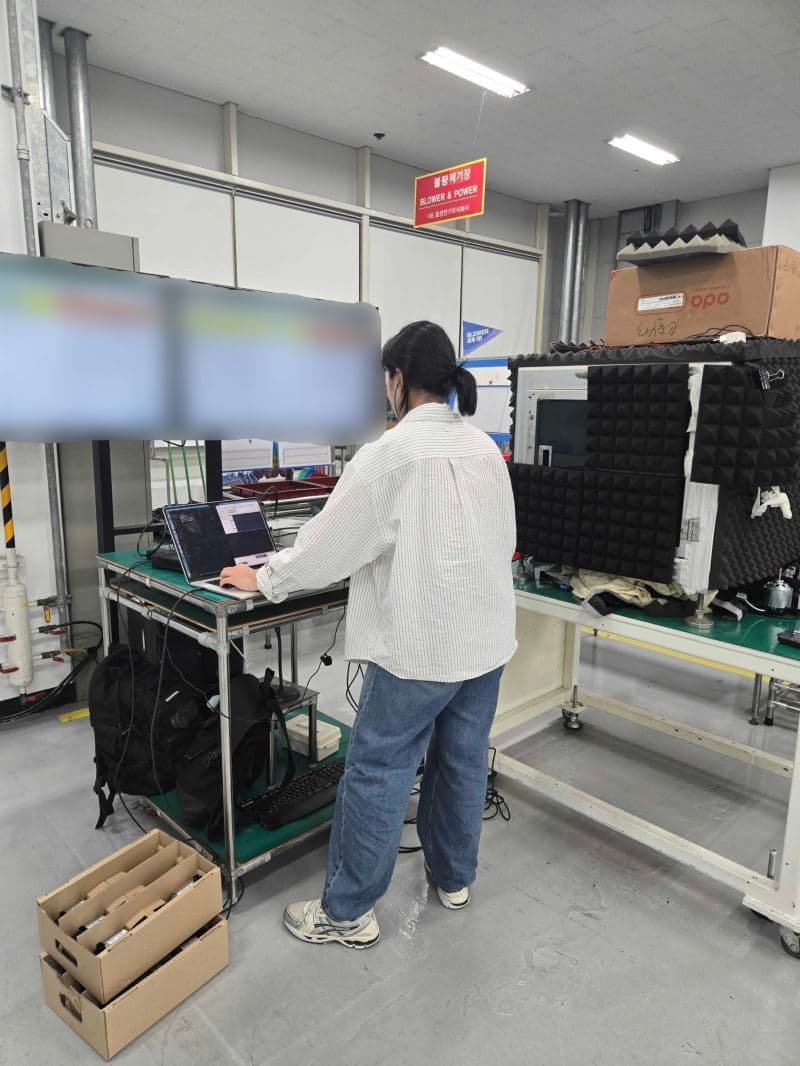 A Deeply team member working on sound inspection at a manufacturing site